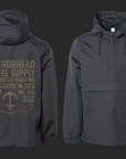 Two views of a black pullover lightweight jacket with hood, featuring text 'Anchorhead Coffee Supply' and anchor graphic in beige on the back.