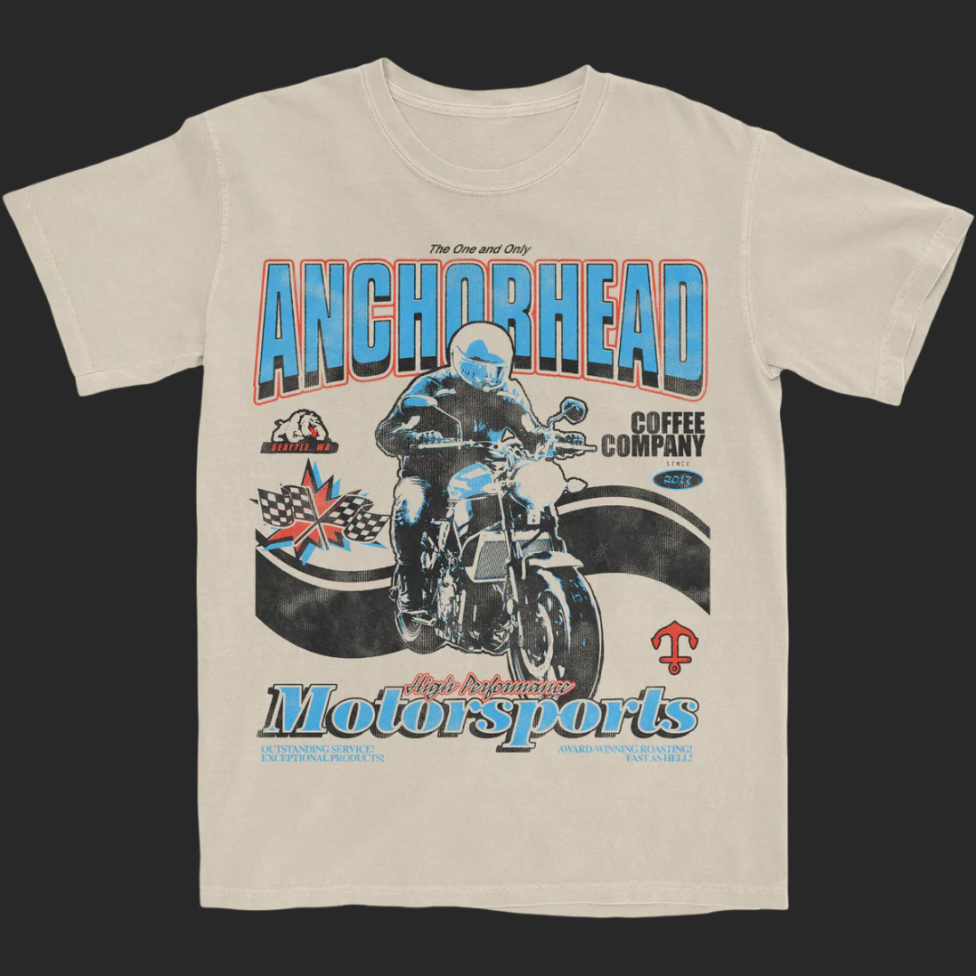 Beige t-shirt with 'Anchorhead Coffee Company Motorsports' graphic design on a black background