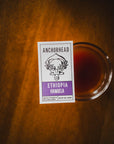 Anchorhead Ethiopia Hamgela coffee label on a glass of coffee