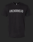 A black t-shirt with 'ANCHORHEAD' printed on it against a dark background